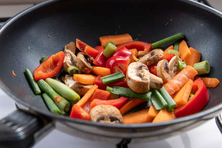 Colourful cut vegetables in a wok for stir fry.の写真素材