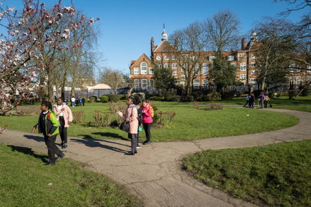 London. UK. 03.11.2021. School children playing in a park, playground after school.のeditorial素材