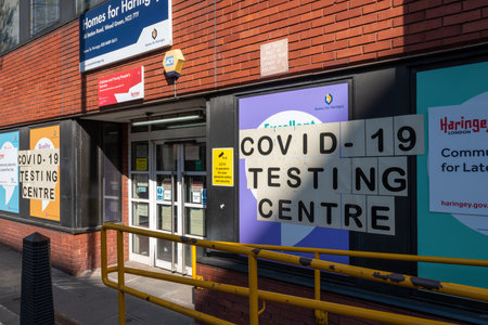 London. UK. 04.24.2021. The signage and frontage of a free Covid-19 testing centre for people without symptoms.のeditorial素材