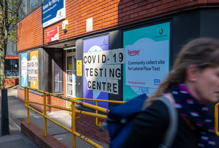 London. UK. 04.24.2021. The signage and frontage of a free Covid-19 testing centre for people without symptoms.のeditorial素材