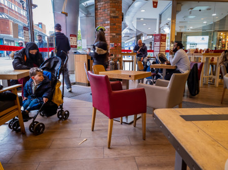London. UK- 05.17.2021: people enjoying the freedom of indoor dinning in a branch of Pret a Manger...