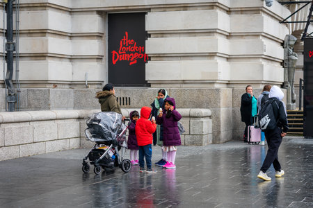 London. UK- 05.23.2021. An Asian family and other visitors enjoying a day out by the popular attraction The London Dungeon in the Riverside Building .のeditorial素材