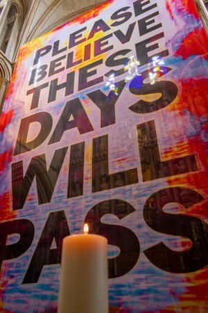 London. UK- 06.10.2021. A huge banner in Southwark Cathedral in reference to Covid-19 pandemic.