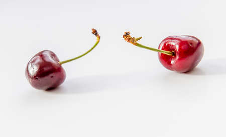 Two cherries isolated on white.の写真素材