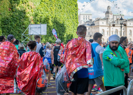 London. UK. 10.03.2021. Runners heading to the Horse Guard Parade after completing the London Marathon.のeditorial素材