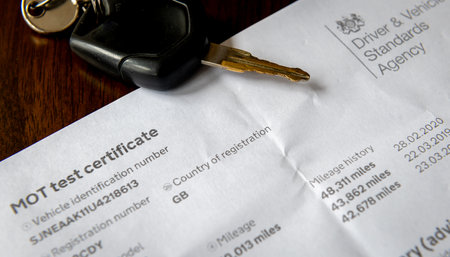 London. UK. 10.07.2021. A MOT test certificate, a legal requirement for motorists to ensure the road worthiness and safety of their motor vehicles.のeditorial素材
