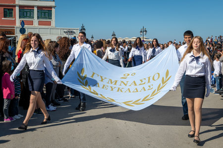 Lefkada. Greece. 10.28.2021. School children marching on the Greek Oxi Day anniversary celebration parade.のeditorial素材
