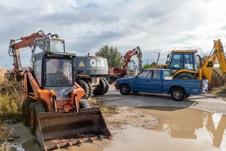 Lefkada. Greece-10.12.2021. New and old heavy construction machinery on a building site.