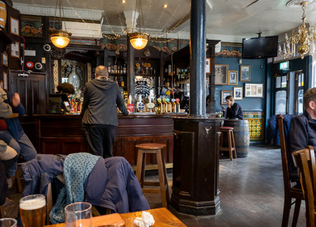 London. UK-04.05.2022. Interior of an English pub with traditional decor. Porcupine public house,Charing Cross Road.のeditorial素材