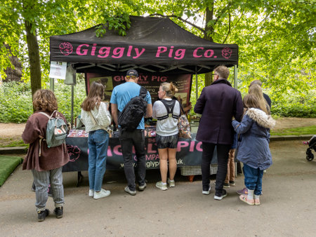 London. UK-05.01.2022. Visitors to the Alexandra Palace Farmers Market buying food in one of many...