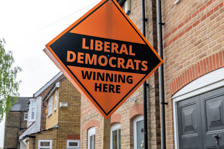 London. UK-04.01.2022. A Liberal Democrats sign board outside a house campaigning for the coming local council election in England.のeditorial素材