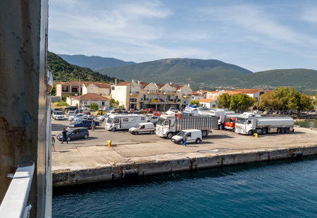 Kefalonia, Greece-05.27.2022. A view of Sami Port with cars and lorries waiting to board the ferry boat.のeditorial素材