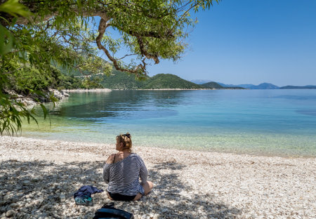 Ithaca island, Greece-05.25.2022. A pristine beach with crystal clear calm water on Ithaca Island, Greece.のeditorial素材