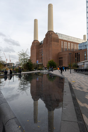 London. UK- 11.02.2022. Exterior view of Battersea Power Station with reflections in its water feature.のeditorial素材