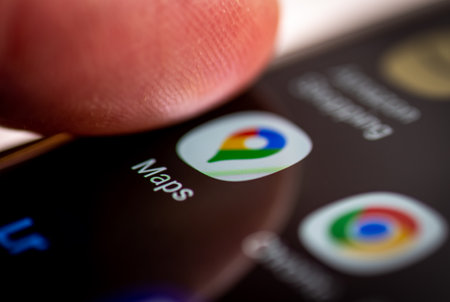 London. UK- 12.31.2022. The icon and name of Google Maps application on a smartphone screen.のeditorial素材