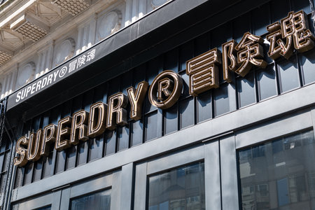 London. UK- 04.09.2023. The facade of the Superdry retail store on Oxford Street showing the company  name sign and logo.のeditorial素材