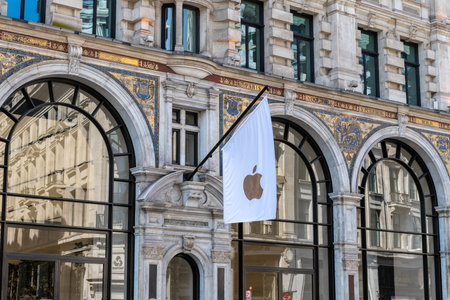 London. UK- 04.09.2023. The Apple logo on a flag on the facade of its Regent Street store.のeditorial素材