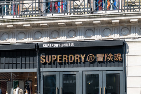 London. UK- 04.09.2023. The facade of the Superdry retail store on Oxford Street showing the company  name sign and logo.のeditorial素材