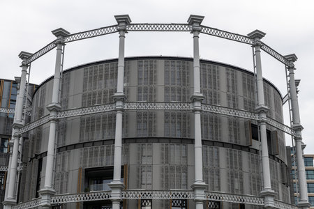 London. UK- 05.04.2023. The facade of Gasholders 10 building constructed within the frame of a decommissioned gas storage tank.のeditorial素材