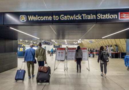 Gatwick.UK- 05.13.2023. Air travel passengers heading to Gatwick Train station for their onward...