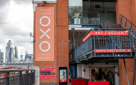 London. UK- 05.17.2023. The street level name sign of the Oxo Tower Building on the south bank of...