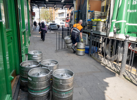 London. UK- 05.25.2023. A brewery driver making a delivery of beer and ale to a pub.のeditorial素材
