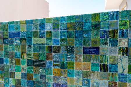 Lisbon. Portugal-07.09.2023. A wall covered with hand made and hand painted tiles.のeditorial素材