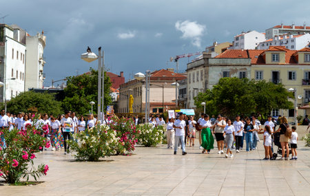 Lisbon. Portugal- 07.08.2023. A group of youths celebrating the upcoming visit by Pope Francis during World Youth Day festival.のeditorial素材