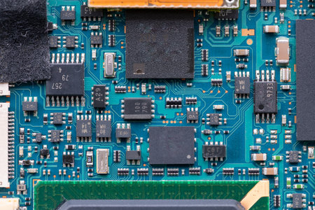 The inside of a electronic device showing the semiconductor circuit board, chip and various parts.