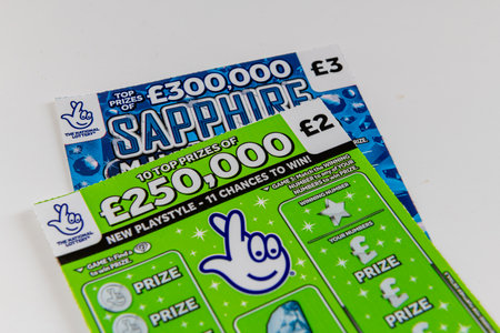 London. UK- 09.27.2023. Two National Lottery scratch cards isolated in white.