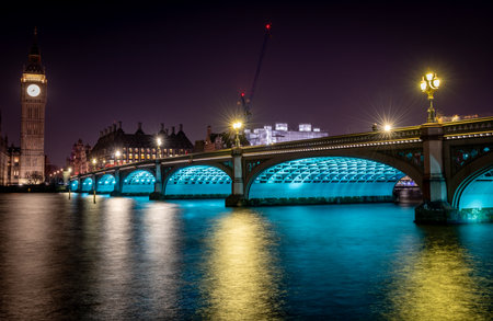 London. UK- 02.04.2024. A night time long exposure view of Westminster Bridge with Big Ben at the...