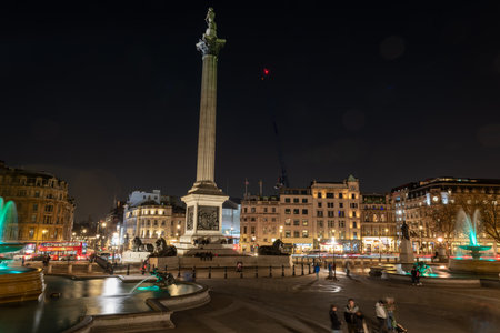 London. UK- 02.04.2024. A night time general view of Trafalgar Square showing Nelson's Column and the water fountains.のeditorial素材