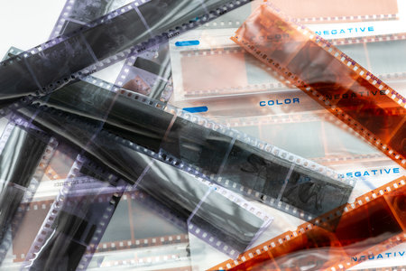 Colour and black and white photo filmstrips negatives on a holding folder.の写真素材