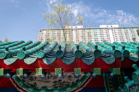 Details of Chinese traditional architecture with colourful complex elements in contrast to a modern...