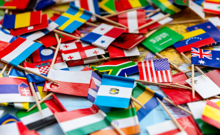 Close up of scattered country flags on a world map background.の写真素材