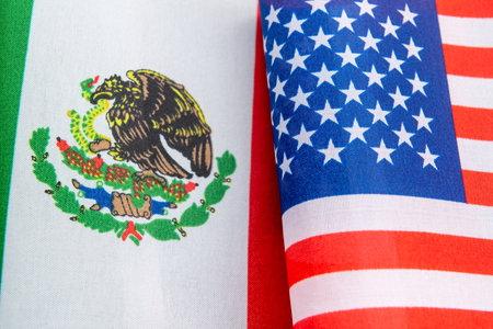 A close up of the national flag of Mexico together with the USA flag. A Mexico, USA relations concept.の写真素材