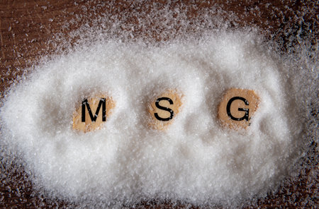 Close up of a heap of monosodium glutamate with the letters M S G.の写真素材