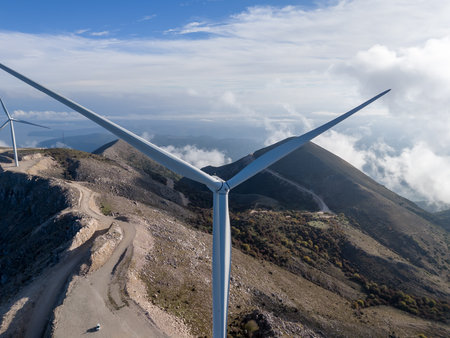 Aerial view of wind turbines on a mountain top wind farm with amazing view of the surrounding...