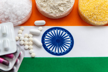 A top view of medicine substances in glass trays, and various loose and packaged medicine on the...