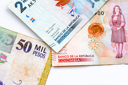 A close up of Colombian Peso bank notes isolated on white.の写真素材