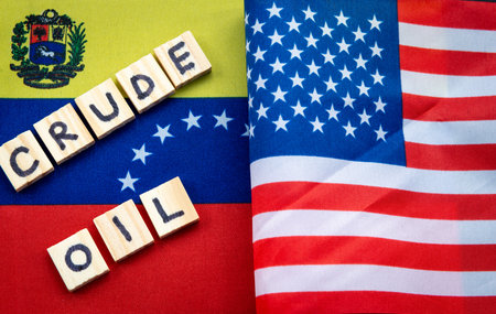 A close up of the national flag of the United States of America on top of the Venezuela flag, and...