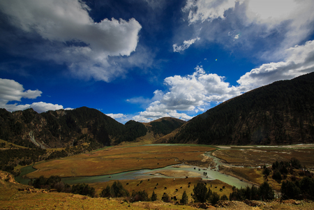 Grassland under the cloudy sky in Sichuanの写真素材