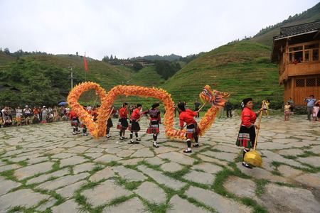 Dragon dance in a village performed by the villagersのeditorial素材