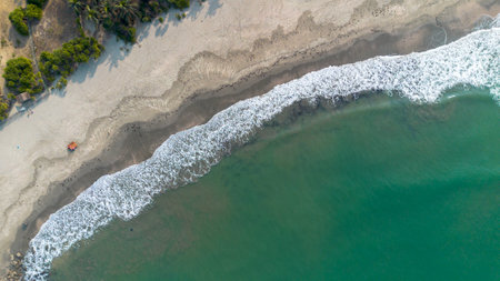 Aerial view of beach and sea waves. Beautiful seascape.