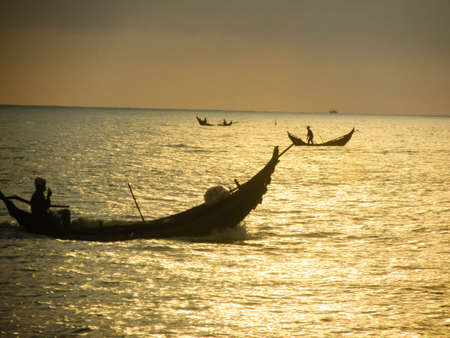 fishing boat at sunset in Quang Tri, Vietnamの写真素材