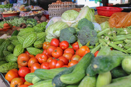 Small stalls selling vegetables and fruits in the marketの写真素材
