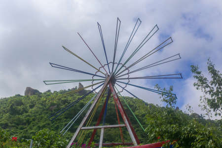 An outdoor iron pinwheel with 7 colours rainbow for decoration in the parkの写真素材