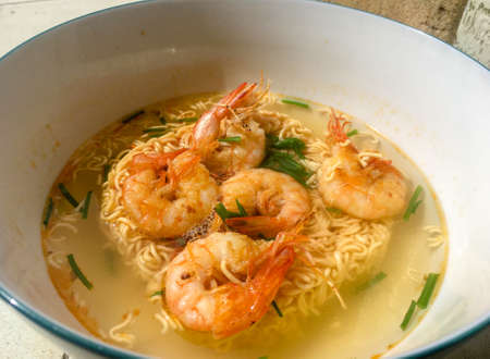 Closeup of instant noodle with shimps and onion