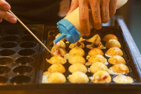 Takoyaki being prepared in Ho Thi Ky street food, ho chi minh cityの写真素材