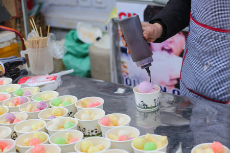 Closeup of Ice cream cups with colorful cakes in the market in Vietnam